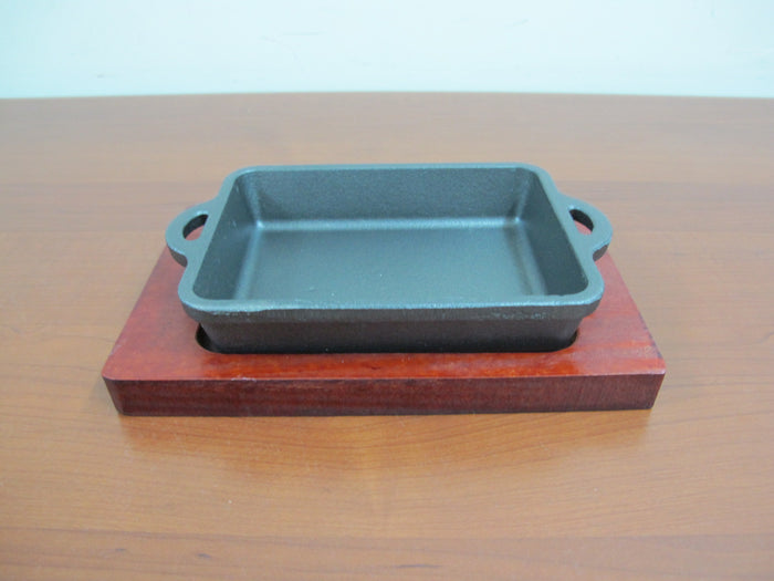 Rectangular cast iron sizzling with wooden base